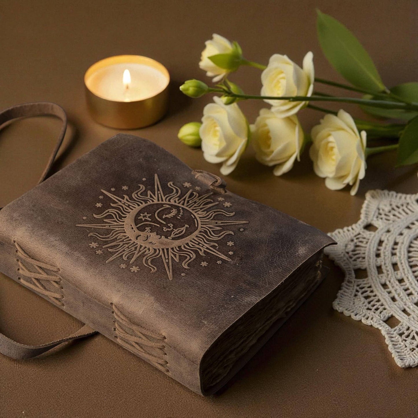 Buff-brown leather journal with a sun motif 7x5 inches