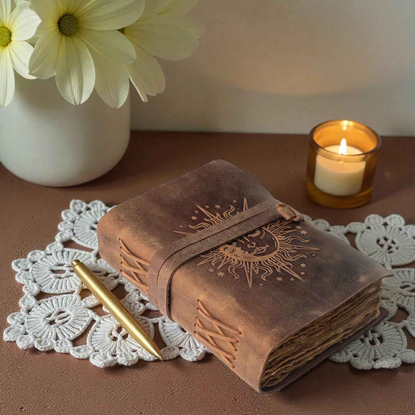 Buff-brown leather journal with a sun motif 7x5 inches