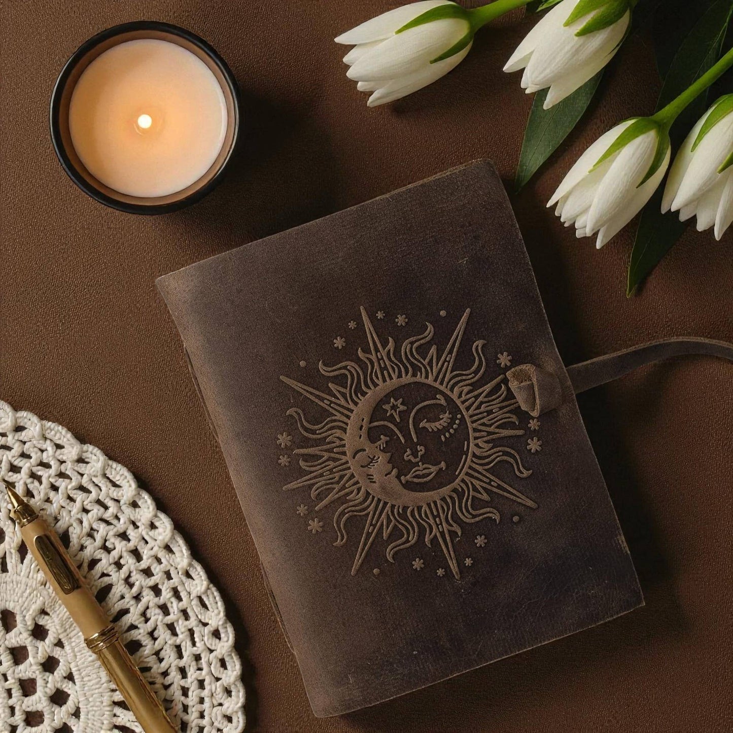 Buff-brown leather journal with a sun motif 7x5 inches
